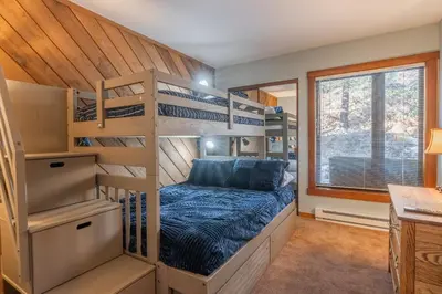 a bedroom with bunk beds in a house at Snowcreek #482 - Updated ! 3 Bedroom + Loft, 2 Bathroom, Sleeps 10! in Mammoth Lakes