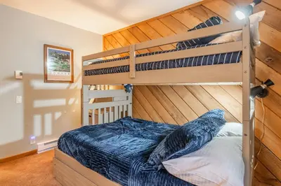 a bedroom with two bunk beds in a room at Snowcreek #482 - Updated ! 3 Bedroom + Loft, 2 Bathroom, Sleeps 10! in Mammoth Lakes