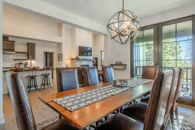 a dining room with a table and chairs at Newly Built Townhome in Snowcreek Creekhouse #1324 Three Bed Three Baths Sleeps 8! Mountain Views! in Mammoth Lakes