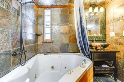a bathroom with a tub and a sink at Shuttle to Slopes Northstar Gem with Hot Tub Access in Truckee