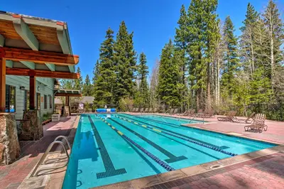 a swimming pool in the backyard of a house at Shuttle to Slopes Northstar Gem with Hot Tub Access in Truckee