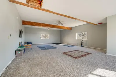 an empty living room with a ceiling at Water Views and Decks Spacious La Grange Retreat in La Grange