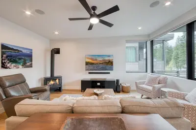 a living room with a couch and a ceiling fan at Lightning Run at Palisades - 3 BR 3 BA Condo steps to Palisades Tahoe- Ski Shuttle in Olympic Valley