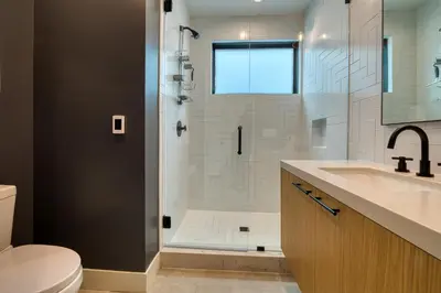 a bathroom with a shower with a sink and a toilet at Lightning Run at Palisades - 3 BR 3 BA Condo steps to Palisades Tahoe- Ski Shuttle in Olympic Valley