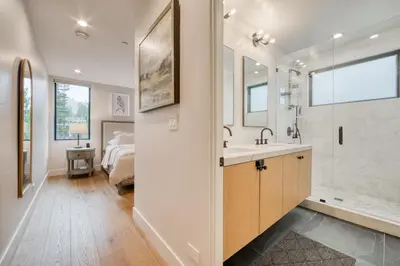 a bathroom with a sink and a shower and a bed at Lightning Run at Palisades - 3 BR 3 BA Condo steps to Palisades Tahoe- Ski Shuttle in Olympic Valley