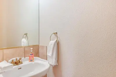 a bathroom with a sink and a mirror at 7 Mi to Beach Home with Hot Tub in South Lake Tahoe in South Lake Tahoe