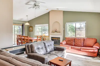 a living room with a couch and a table at 7 Mi to Beach Home with Hot Tub in South Lake Tahoe in South Lake Tahoe