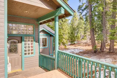 a front porch of a house with a door at 7 Mi to Beach Home with Hot Tub in South Lake Tahoe in South Lake Tahoe