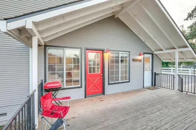 a house with a red door on a porch at 12 Mi to Folsom Historic District NorCal Getaway in Fair Oaks