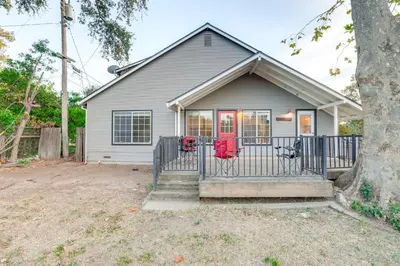 a house with a gate and a tree at 12 Mi to Folsom Historic District NorCal Getaway in Fair Oaks