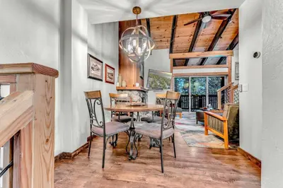 a dining room with a table and chairs at Tahoe Condo Near Skylandia Beach in Tahoe City