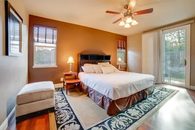 a bedroom with a bed and a ceiling fan at Ski Getaway with Hot Tub Reno Home By Attractions in Reno