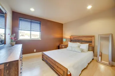 a bedroom with a large bed and a window at Ski Getaway with Hot Tub Reno Home By Attractions in Reno