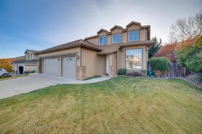 a large house with a grassy yard at Ski Getaway with Hot Tub Reno Home By Attractions in Reno