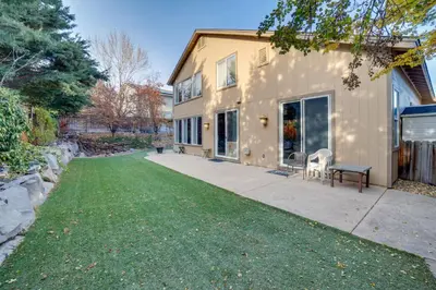 a house with a lawn in front of it at Ski Getaway with Hot Tub Reno Home By Attractions in Reno