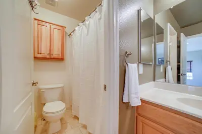 a bathroom with a toilet and a sink at Ski Getaway with Hot Tub Reno Home By Attractions in Reno