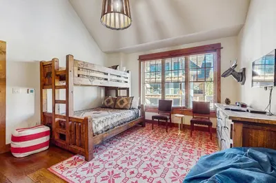 a bedroom with a bunk bed and a desk at Northstar Escape in Kingswood Estates
