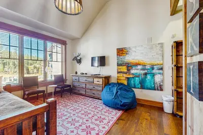 a bedroom with a bed and a large painting on the wall at Northstar Escape in Kingswood Estates