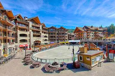 a resort with a pool and chairs and buildings at Northstar Escape in Kingswood Estates