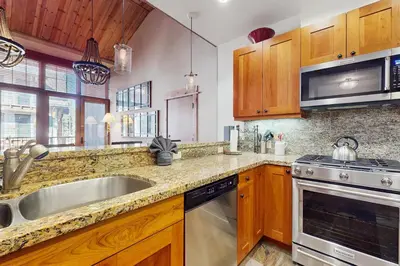 a kitchen with a sink and a stove top oven at Northstar Getaway in Truckee