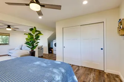 a bedroom with a bed and a ceiling fan at Ski, Hike and Fish Mtn-View Gem with Deck in Tuolumne in Tuolumne