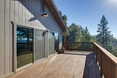 a large wooden deck on the side of a house at Ski, Hike and Fish Mtn-View Gem with Deck in Tuolumne in Tuolumne