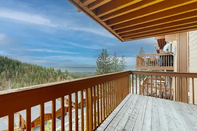 a balcony of a house with a view of the woods at Bear-foot Retreat in Incline Village