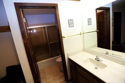 a bathroom with a sink and a shower and a mirror at Updated Mammoth condo on Red line in Mammoth Lakes