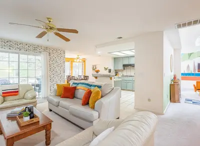 a living room with a couch and a table at Heaven Heights - HotTub, Pet Friendly, EV Outlet, Pool Table, Game Room, BBQ, FirePit, Library in Oakhurst