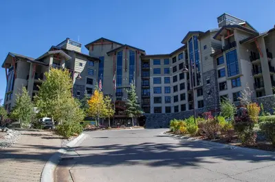a large apartment building with a road in front of it at Updated Pet Friendly Monache Studio with Views! in Mammoth Lakes
