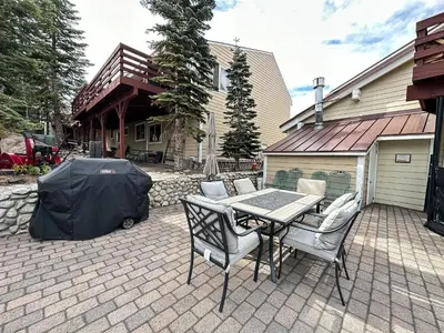 a patio with a table and chairs and a tent at Lakeview Villas #06 condo in Mammoth Lakes
