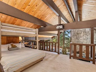 a bedroom with two bunk beds and a wooden ceiling at Awesome Home Above the Lake - Dogs Welcome VH315 in Bear Valley