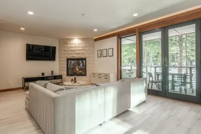 a living room with a couch and a fireplace at Obsidian 210 in Mammoth Lakes
