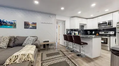 a living room with a couch and a kitchen at Sierra Manors #61 condo in Mammoth Lakes