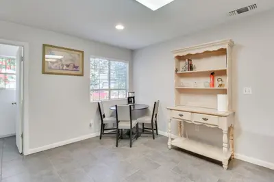 a dining room with a table and a desk at 4 Mi to San Joaquin River Peaceful Patterson Home in Patterson