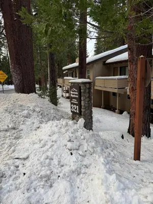 a sign in the snow in front of a cabin at Lake Tahoe Incline Beach Ski Pool Pets Casino in Incline Village