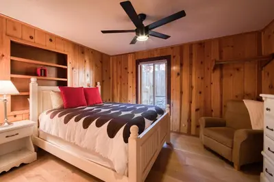 a bedroom with a bed and a ceiling fan at Wanderlust Retreat by Tahoe Getaways - 4BR Pet-Friendly w Fenced Yard, Walking Distance to Lake! in Tahoe City
