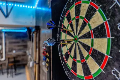 a dart board with some darts in the middle at Modern 3-Bedroom Escape in Northwest Reno in Reno