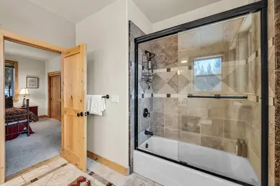 a bathroom with a tub and a shower stall at Spacious Tahoma Retreat with Hot Tub and Game Room in Tahoma