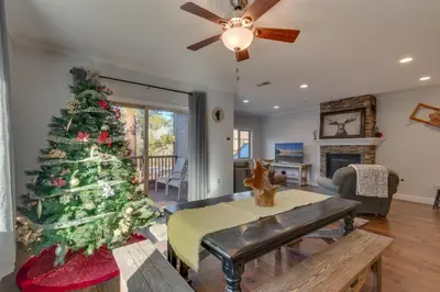 a christmas tree in a living room with a table at 3987 - Upscale Townhouse Walk to Heavenly, Casino and Beach in South Lake Tahoe