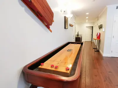 a ping pong table in a room with a pool table at 3987 - Upscale Townhouse Walk to Heavenly, Casino and Beach in South Lake Tahoe