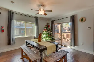 a living room with a christmas tree and a table at 3987 - Upscale Townhouse Walk to Heavenly, Casino and Beach in South Lake Tahoe