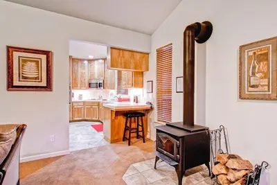 a kitchen with a stove in the middle of a room at Eagles Nest in Yosemite West