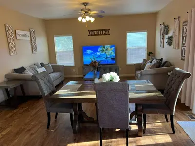 a living room with a wooden table and a couch at Cozy House in Fallon- 3BedRoom, 2BathRooms in Fallon