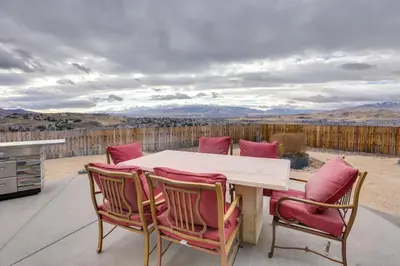 a table and chairs on a patio with a view at Mtn-View Haven with Hot Tub! 28 Mi to Mt Rose Ski in Sparks