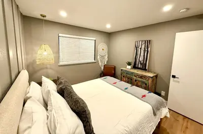 a bedroom with a large white bed and a window at The Ultimate Mountain Retreat close Yosemite and Bass Lake in Oakhurst
