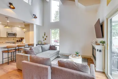 a living room with a couch and a kitchen at 8 Mi to Northstar Slopes Tahoe Gem with Fireplace in Kings Beach