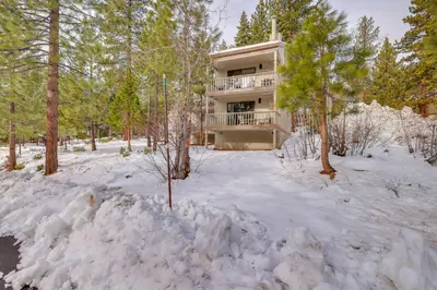 a house in the woods in the snow at 8 Mi to Northstar Slopes Tahoe Gem with Fireplace in Kings Beach