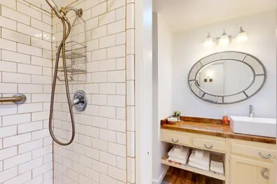 a bathroom with a sink and a mirror at The Firelight Lodge in Oakhurst