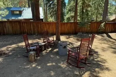 a group of chairs and a table in a yard at Spacious Tahoe Hot Tub and Beach in Kings Beach
